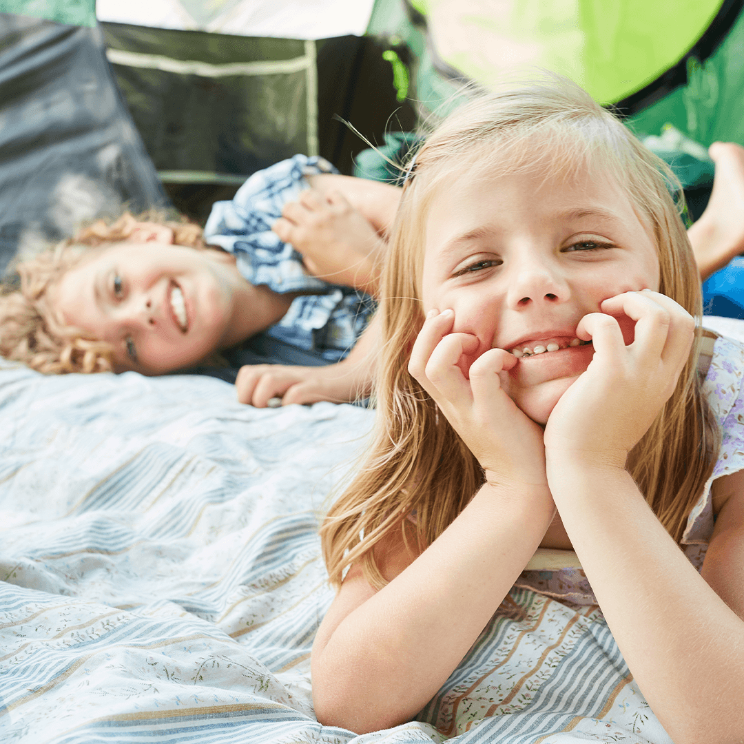 Kids relaxing in a backyard fort – calm and cozy summer fun for children
