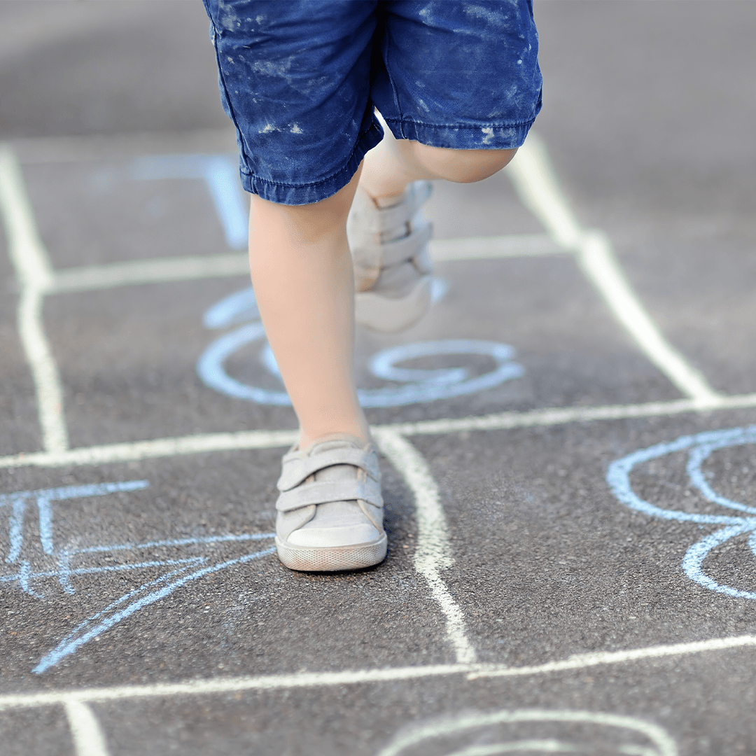 Girl playing hopscotch – fun and active movement for children through play